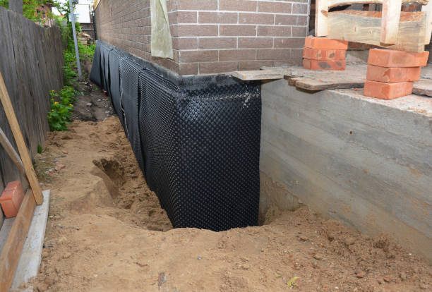 Happy homeowners after waterproofing job in Eagle